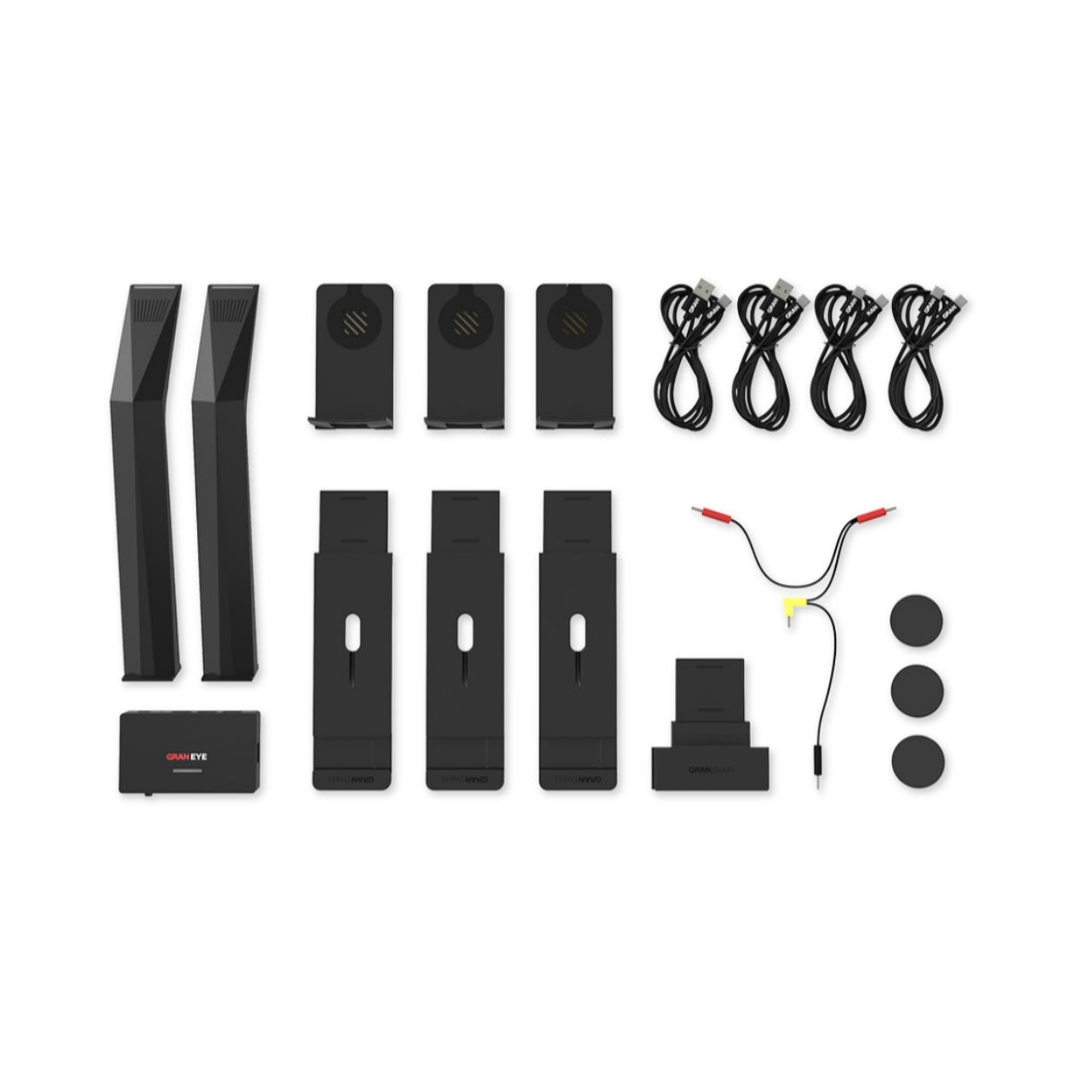 GRAN EYE G2 kit: two cameras, hub, magnetic mounting components, cables and stability pads on white. Dartboard, surround, display device and power adapter are not included.