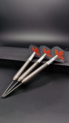 Loxley John Part 90% tungsten steel tip darts set in a lifestyle product display